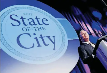  ?? Mayor Mick Cornett gives his annual State of the City speech Wednesday during a luncheon hosted by the Greater Oklahoma City Chamber at the Cox Convention Center in Oklahoma City. ?? [PHOTO BY NATE BILLINGS, THE OKLAHOMAN]