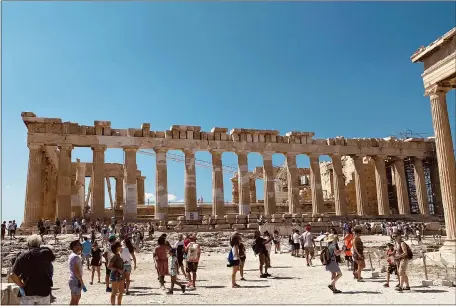  ?? COURTESY OF CATHRYN KNEZEVICH ?? The Parthenon, which is undergoing rehabilita­tion, is the major temple to be seen by visitors after a climb to the Acropolis in Athens.