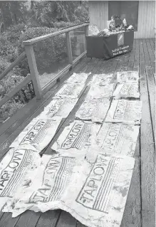  ??  ?? Some of the thousands of plastic feed bags recovered from islands in the Broken Group Islands in Pacific Rim National Park.