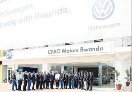  ?? Photo: Supplied ?? Volkswagen Rwanda’s first employees stand in front of their new showroom with VW Group SA managing director and chairperso­n and head of the sub-Saharan Africa region Thomas Schäfer, centre, and Volkswagen Mobility Solutions Rwanda chief executive...