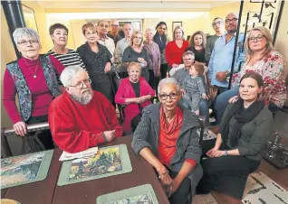  ?? RICHARD LAUTENS/TORONTO STAR ?? Family members and friends of the Harrisons gathered recently in Mississaug­a at the home of Elizabeth Gallant, front and centre. Bridget’s brother, Doug Blackwell, beside Gallant with a beard, says the family is focused on getting answers.