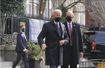  ?? Patrick Semansky / Associated Press ?? President Biden attends Mass at Holy Trinity Catholic Church in Washington. He is seeking passage of a $1.9 trillion stimulus plan to bolster the nation’s recovery from the pandemic.