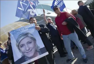  ?? MICHEL EULER, THE ASSOCIATED PRESS ?? Supporters of Marine Le Pen wait outside to attend a meeting in Marseille, southern France, on Wednesday.