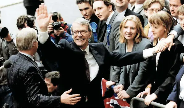  ?? ALAMY. ?? Prime Minister John Major celebrates the Conservati­ves’ General Election victory outside 10 Downing Street on April 10 1992. Although widely expected to lose the election, his overall parliament­ary majority of 21 would enable his government to oversee the break-up and privatisat­ion of British Rail within the next five years.