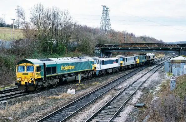  ??  ?? Last month a mysterious bug caused the wrong photo to be packaged (page 23) when sending the pages to the printer. To amend the error here’s the correct shot. Freightlin­er Class 66/6 66610 leads Class 90s 90012, 90048 and 90016, with 66620 at the rear across the Pennines on January 4 as the 0E90 Crewe Basford Hall to Leeds Midland Road for wheel lathe attention at Midland Road. (Russell Wykes)