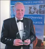  ??  ?? Kenny MacLeod with his Lifetime Achievemen­t Award for services to the constructi­on industry.