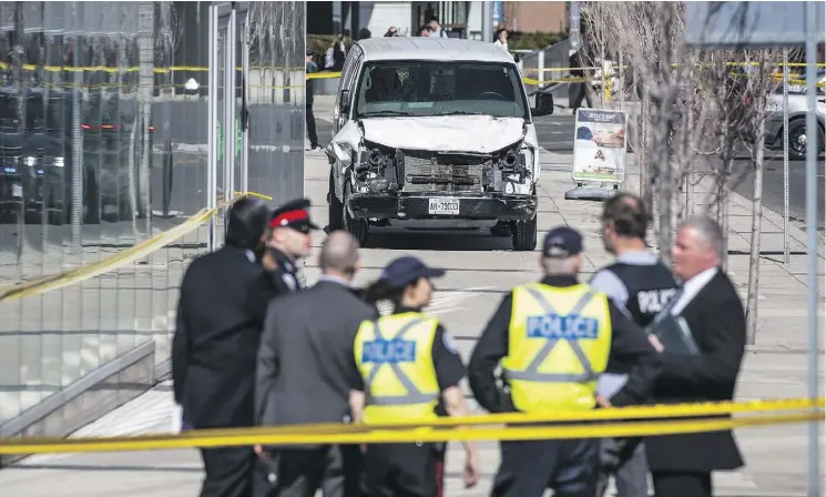 ?? AARON VINCENT ELKAIM/THE CANADIAN PRESS ?? Police in Toronto survey a damaged van after it drove down a busy sidewalk on Yonge Street Monday afternoon, leaving at least 10 dead and 15 injured.