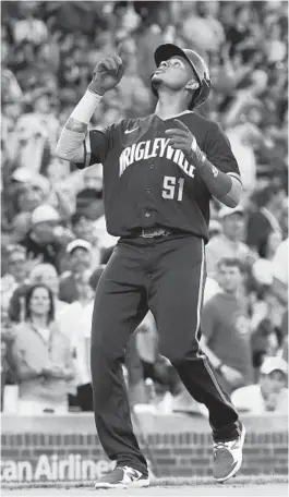  ?? JOHN J. KIM/CHICAGO TRIBUNE ?? Cubs second baseman Sergio Alcantara crosses the plate after hitting a home run in the third inning against the Cardinals at Wrigley Field on Saturday.