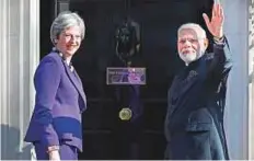  ?? Reuters ?? Britain’s Prime Minister May greets Modi as he arrives at 10 Downing Street to attend a bilateral meeting on the sidelines of CHOGM.