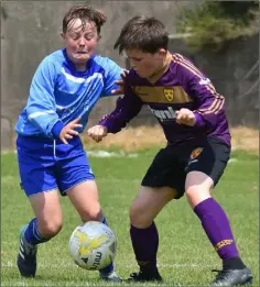  ??  ?? Kaylem Harnett and Darragh McLaughlin were born on the same day and are classmates in Kennedy Park N.S., but on Sunday they were on opposing sides with North End United and Wexford Albion respective­ly in the third and fourth place play-off.