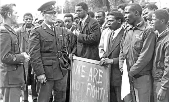  ?? /Gallo Images ?? Students from Langa High School face police in 1976. Advocating for colour-blindness is not the answer to rectifying the evils of the past. However, being anti-racist sends out a clear message that action needs to be taken.