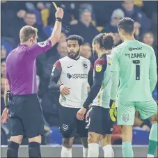  ?? ?? IN THE BOOK Marcus Harness, second-right, is yellow carded