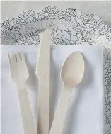  ?? JENNIFER CHASE/THE WASHINGTON POST ?? Raise the bar with real plates, glasses, silverware and napkins — or, for a less expensive option, disposable wooden cutlery comes in an assortment of shapes and sizes.