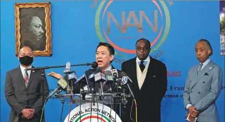  ?? MARK LENNIHAN / ASSOCIATED PRESS ?? Charles Yoon, president of the Korean American Associatio­n of Greater New York, speaks out against anti-Asian hate crimes during a news conference on Thursday in New York. Behind him are Wayne Ho (left), president of the Chinese-American Planning Council, and black civil rights activist Al Sharpton (right).
