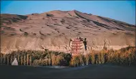  ?? XU HAIYANG / FOR CHINA DAILY ?? The Mogao Caves, a long-establishe­d UNESCO World Heritage Site, is Gansu province’s signature spot.