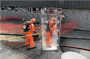  ?? PHOTO: SUPPLIED ?? Firefighte­rs had to go through a decontamin­ation process after a chemical overheated.
