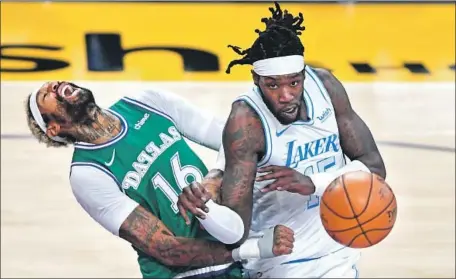  ?? NO FOUL WAS CALLED Photog r aphs by Wally Skalij Los Angeles Times ?? on this play as the Lakers’ Montrezl Harrell collides with the Mavericks’ James Johnson during the second quarter. Harrell, the reigning sixth man of the year, had 22 points on 10- for- 13 shooting and seven rebounds off the bench.