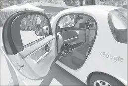  ??  ?? A Google self-driving car is shown at Google’s I/O conference in Mountain View in May.