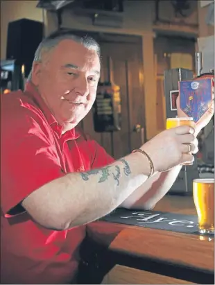  ??  ?? Jim Glendinnin­g pours a pint of Roods Royal Ale.