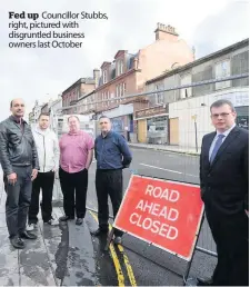  ??  ?? Fed up Councillor Stubbs, right, pictured with disgruntle­d business owners last October