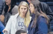  ?? HARTFORD COURANT
BRAD HORRIGAN/ ?? Saylor Poffenbarg­er, left, and Caroline Ducharme watch the UConn women battle Oregon on Feb. 3 at Gampel Pavilion. Poffenbarg­er, a guard in the Class of 2021, will join the Huskies this semester.