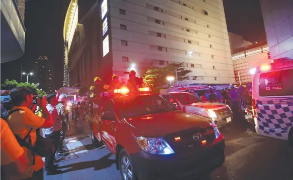  ?? Picture: AP ?? Firefighte­rs at the scene of the deadly fire at the CentralWor­ld mall complex – one of the largest in Bangkok.