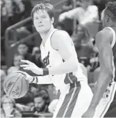  ?? JIM RASSOL/STAFF FILE PHOTO ?? Terry Porter, above, has been named coach at University of Portland, Heat Erik Spoelstra’s alma mater. Heat forward Luke Babbitt, left, has a “slight strain,” Spoelstra says.