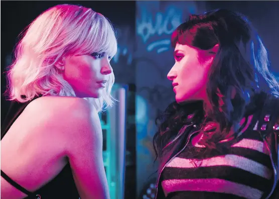  ?? FOCUS FEATURES ?? Charlize Theron, left, and Sofia Boutella star in Atomic Blonde, which winds up being a rather joyless affair.