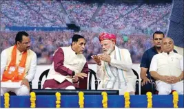  ?? PTI ?? Prime Minister Narendra Modi with Gujarat Chief Minister Vijay Rupani (2nd L), Dy CM Nitin Patel (R) and State BJP chief Jitu Vaghani (L) during a party meeting at the airport in Ahmedabad, Wednesday