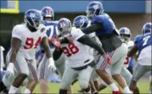  ?? THE ASSOCIATED PRESS ?? Giants defensive tackle Damon Harrison (98) works out with teammates Wednesday in East Rutherford.