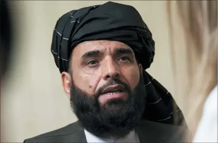  ?? ASSOCIATED PRESS FILE ?? Suhail Shaheen, spokesman for the Taliban’s political office in Doha, speaks to the media in 2019. The countdown to the signing of a peace agreement between the Taliban and the United States to end the 18years of war in Afghanista­n has begun.