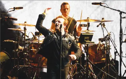  ?? Canadian Press photo ?? U2 perform during the opening concert of their "Joshua Tree" tour in Vancouver, Friday.