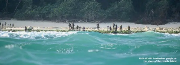  ??  ?? ISOLATION: Sentineles­e people on the shore of the remote island