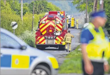  ??  ?? Emergency crews at Forstal Lane