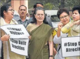  ?? PTI PHOTO ?? Former Congress president Sonia Gandhi with Opposition party members during a protest in Parliament during the budget session in New Delhi on Thursday.