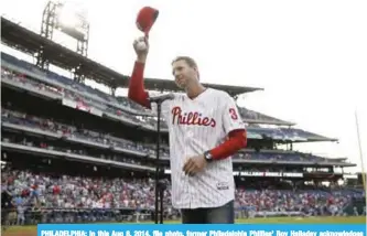  ??  ?? PHILADELPH­IA: In this Aug 8, 2014, file photo, former Philadelph­ia Phillies’ Roy Halladay acknowledg­es the crowd before a baseball game against the New York Mets, in Philadelph­ia. — AP