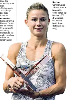  ?? (Afp) ?? Sorriso Camila Giorgi, 29 anni, nata a Macerata, con il trofeo del Master 1000 di Montreal, in Canada, terzo titolo della carriera