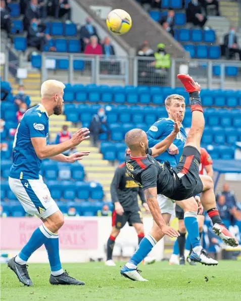  ??  ?? Rangers’ Kemar Roofe has an acrobatic effort on goal at Mcdiarmid Park yesterday