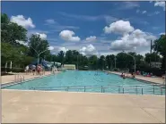  ?? PHOTO COURTESY OF LANSDALE PARKS AND RECREATION ?? Lifeguards and residents swim in the Fourth Street Pool in Lansdale on the first day of the pool’s abbreviate­d 2020 season on Wednesday, July 1.