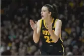 ?? ABBIE PARR — THE ASSOCIATED PRESS ?? Iowa guard Caitlin Clark (22) claps during the second half of a game against Minnesota on Wednesday in Minneapoli­s.