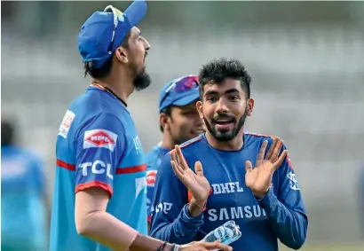  ?? PTI ?? Delhi Capitals’ Ishant Sharma and Mumbai Indians’ Jasprit Bumrah during a practice session in Mumbai. —