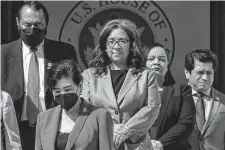  ?? Alex Brandon/Associated Press ?? Rep. Marilyn Strickland, D-Wash., center, at the Capitol. Basic allowance for housing needs regular updating, she has said.