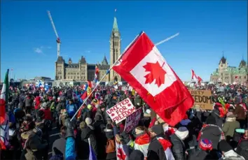  ?? Lars Hagberg/AFP via Getty Images ?? Supporters arrive at Parliament Hill for the “Freedom Truck Convoy” to protest against COVID19 vaccine mandates and restrictio­ns Saturday in Ottawa, Canada.