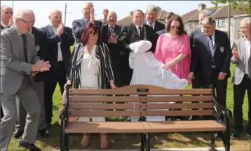  ??  ?? The unveiling of the commemorat­ive bench.