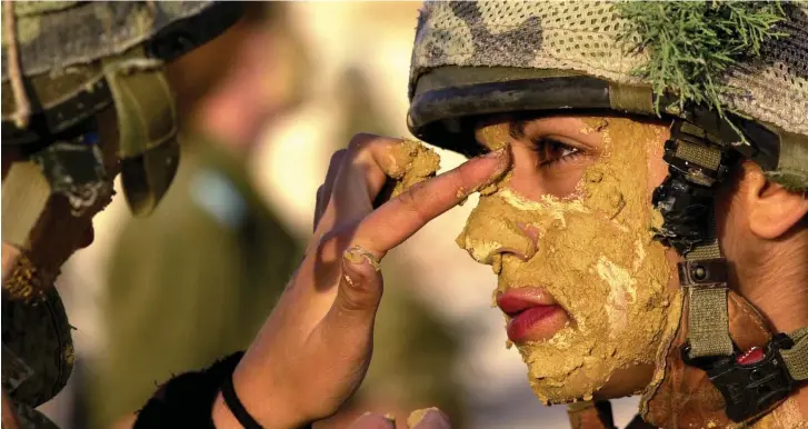  ?? (Reuters) ?? THE NUMBER of women in IDF combat positions has more than doubled over the past half decade. What has also doubled this decade is the number of observant women who have joined the military.