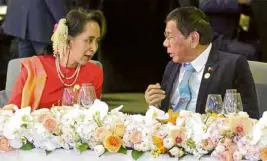  ?? —MALACAÑANG PHOTO ?? DINNER CHAT President Duterte chats with Myanmar State Counselor Aung San Suu Kyi during a summit welcome dinner hosted by South Korean President Moon Jae-in at Hilton Busan Hotel on Monday.