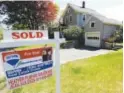  ?? Steven Senne, The Associated Press ?? A “sold” sign sits in front of a house in Walpole, Mass., in May. Sales of existing homes fell in July.