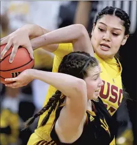  ?? Isaac Brekken Associated Press ?? USC FORWARD Alissa Pili steals the ball from Arizona State guard Maggie Besselink during a first-round game in the Pac-12 women’s tournament.