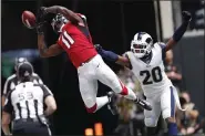  ?? JOHN BAZEMORE - THE ASSOCIATED PRESS ?? Atlanta Falcons wide receiver Julio Jones (11) misses the catch against Los Angeles Rams cornerback Jalen Ramsey (20) during the first half of an NFL football game, Sunday, Oct. 20, 2019, in Atlanta.