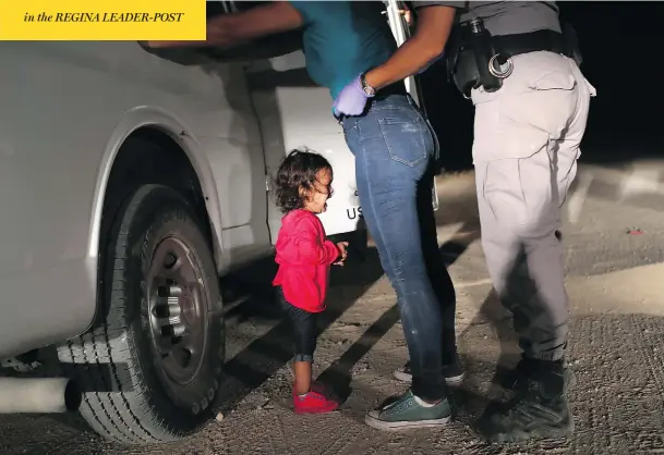  ?? JOHN MOORE / GETTY IMAGES ?? A two-year-old Honduran asylum seeker cries as her mother is searched and detained near the U.S.-Mexico border on Tuesday in McAllen, Texas.